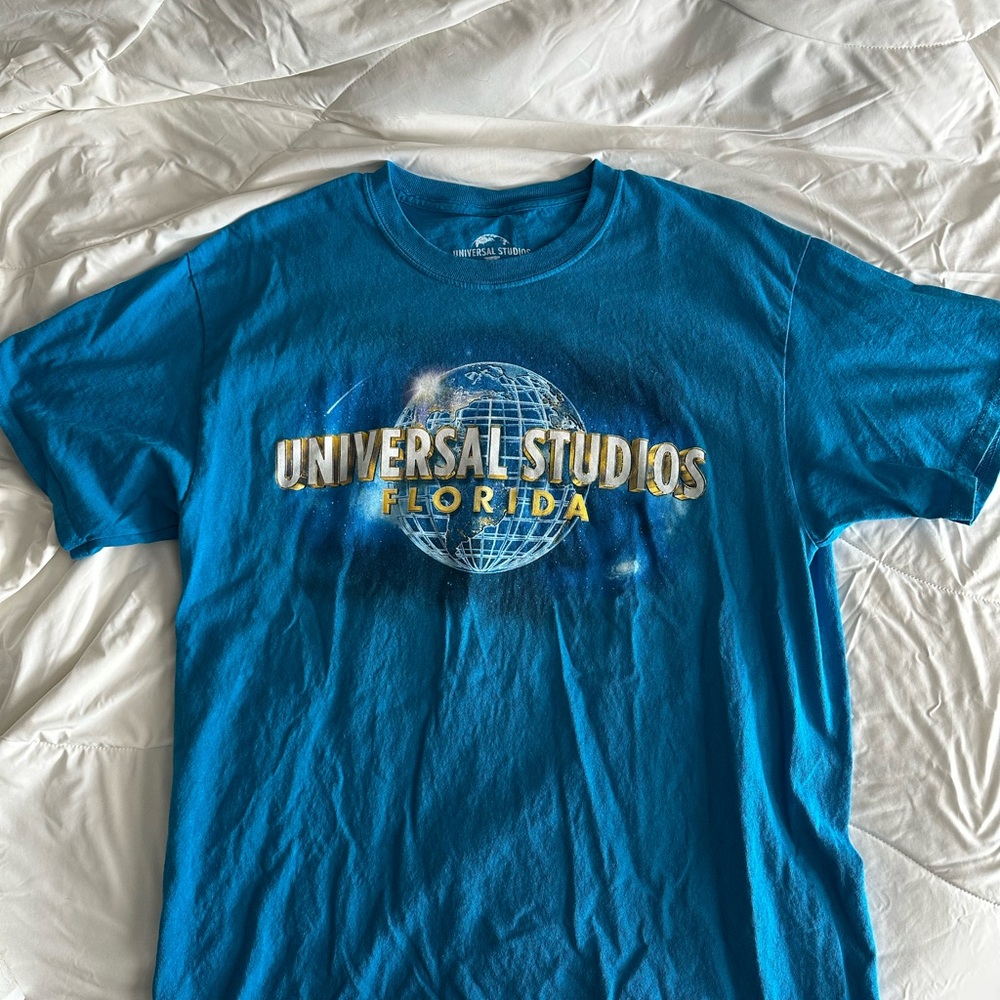 Universal Blue Graphic Tee with Gold Lettering - Men's Short Sleeve